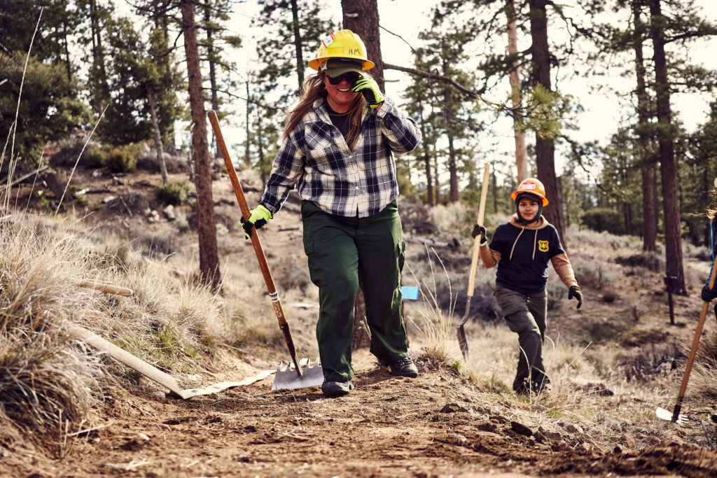 Its great to see smiling USFS staff swinging tools!